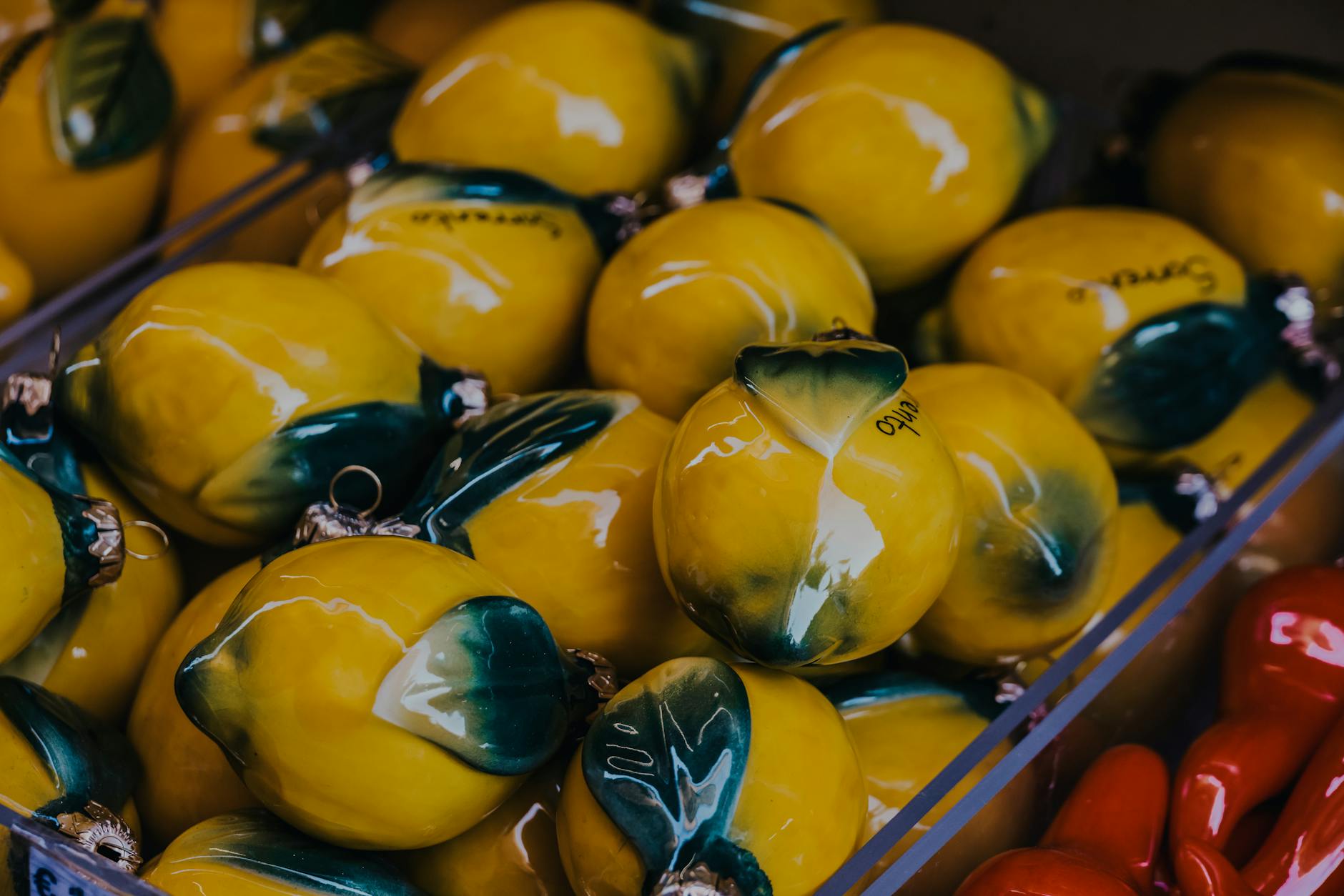 Vibrant yellow ceramic lemons displayed artfully, symbolizing consistent pleasure and renewal