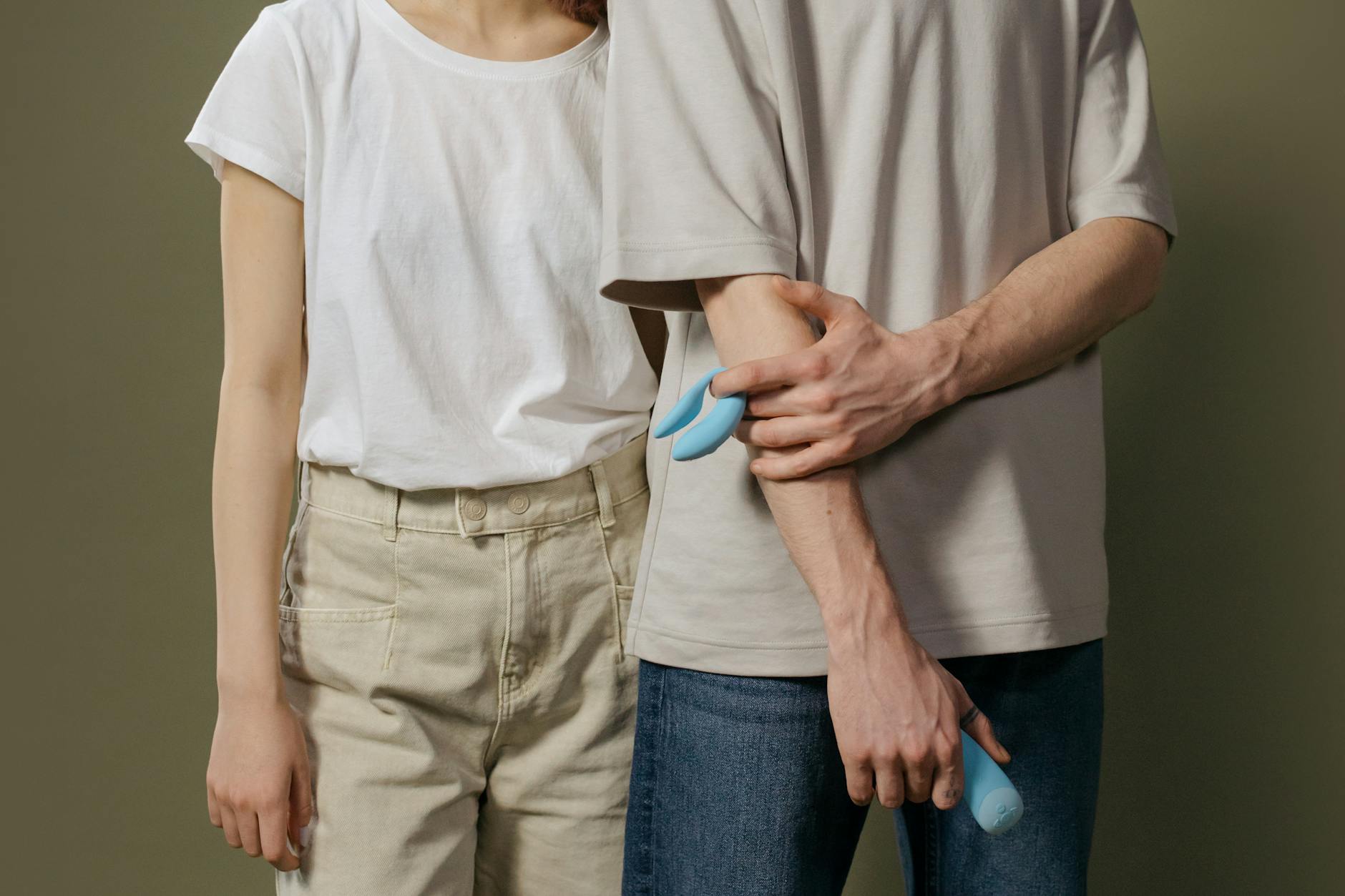 A blue silicone lemon suction toy held against a purple background, symbolizing clitoral pleasure and sensation recovery